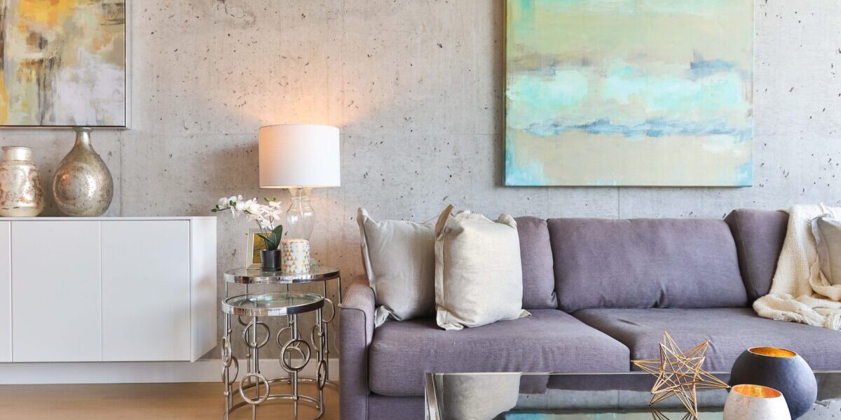 white-wooden-sideboard-beside-gray-padded-sofa